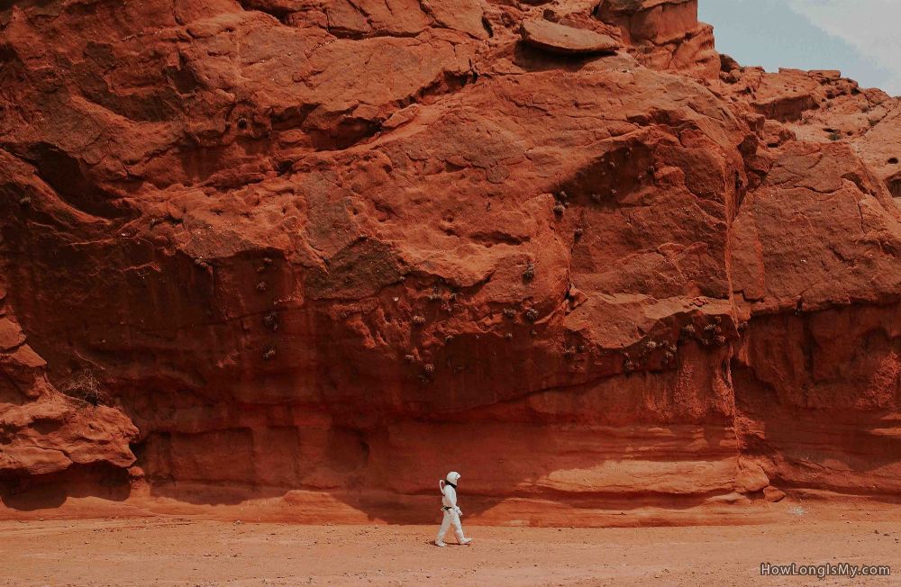 austronat walking on mars red planet