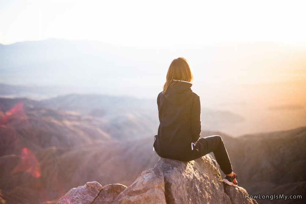 purpose of life woman on a rock