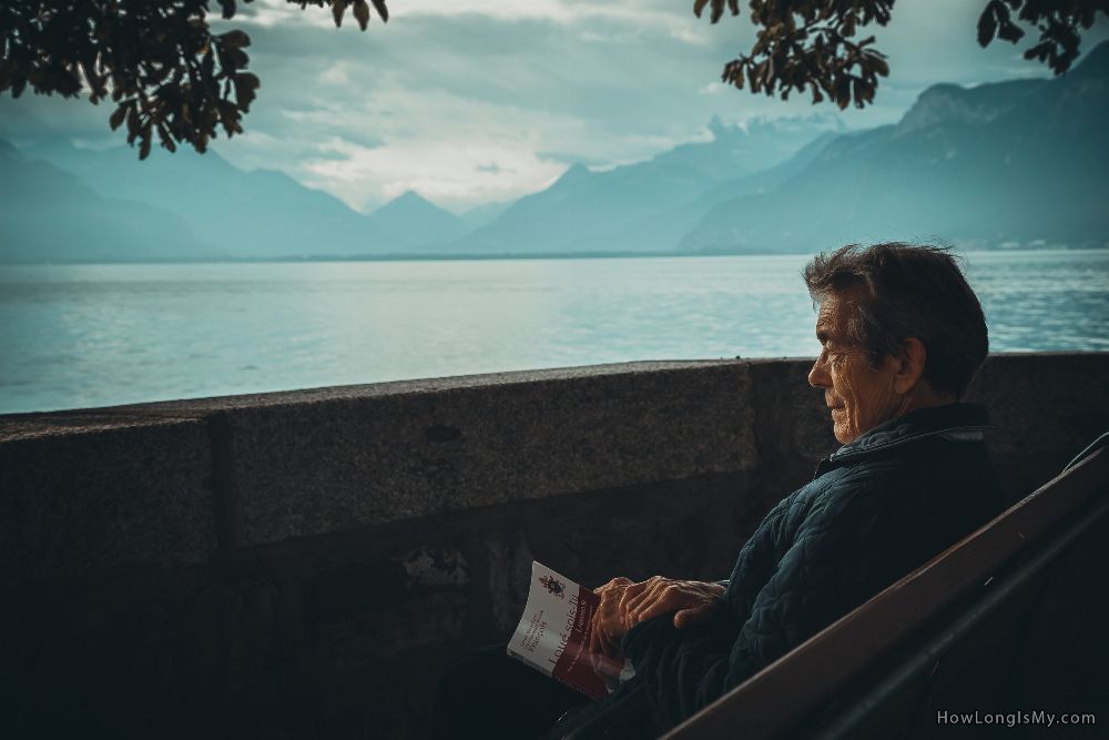 an older man looking into the ocean